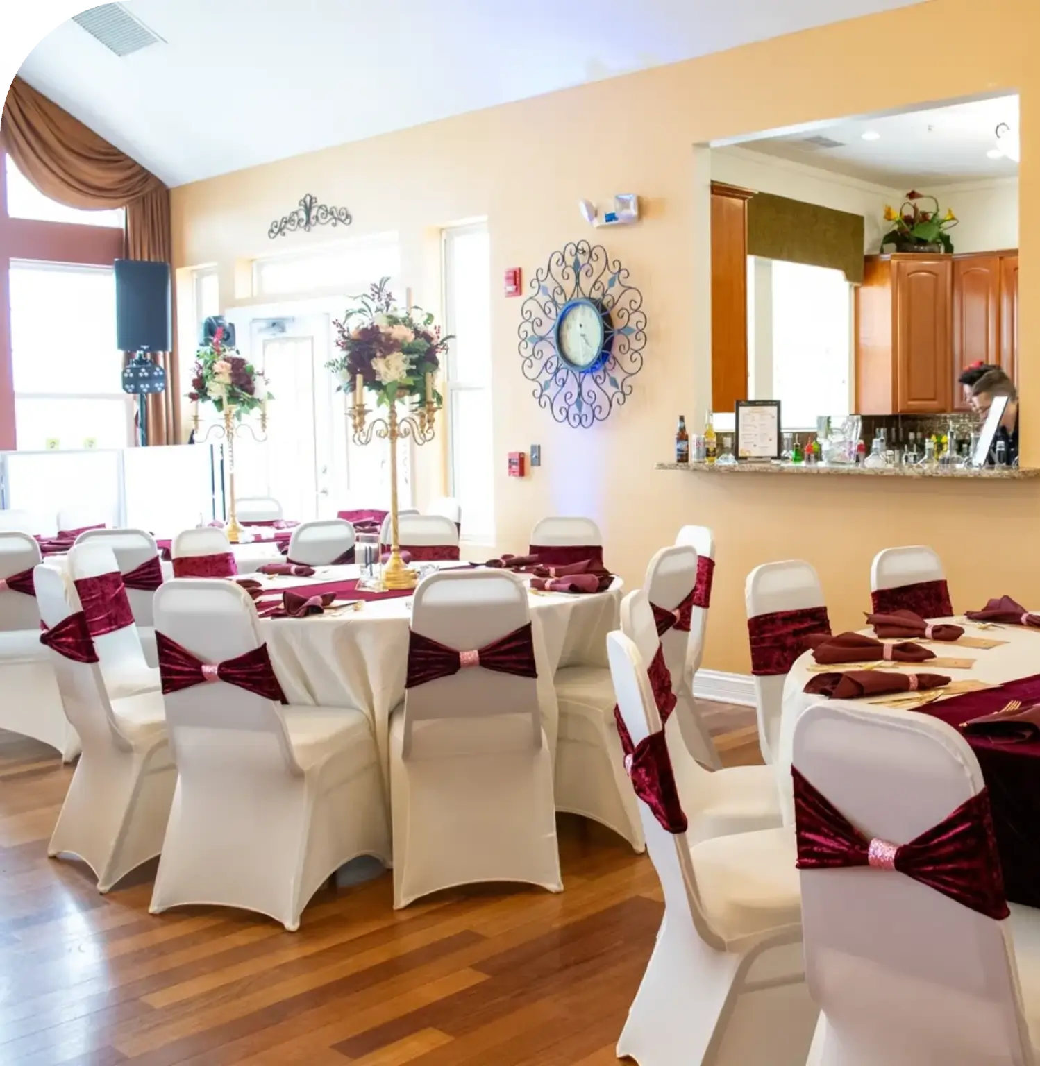 Elegant dining setup with white and burgundy.